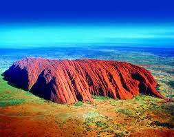 Uluru from the air. It is almost a 10km walk around the base of Uluru, the world's largest rock and and a major Indigenous cultural icon and gathering place. Image: NT Tourism.