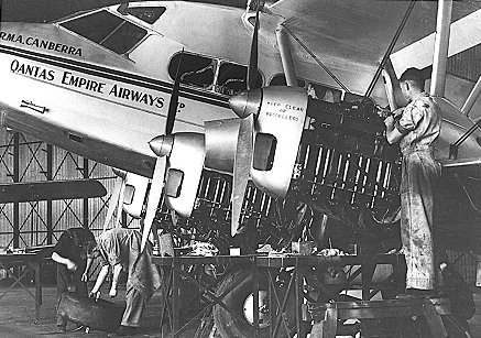 A Qantas de Havilland 86 Dragon Rapide airliner undergoing maintenance in Hangar 5, 1930s.