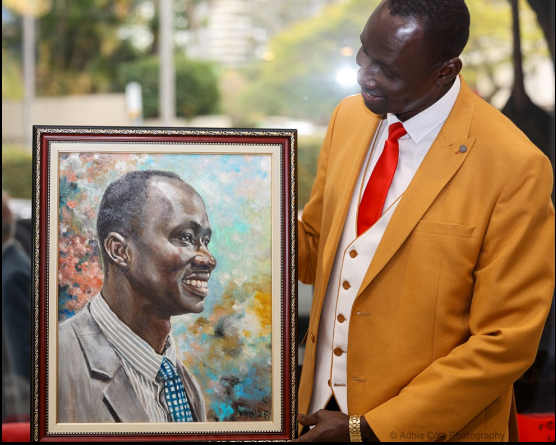 QACC President Beny Bol views his portrait by renowned Chinese artist Yunin Yang.