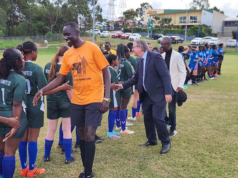 QACC leadership members congratulate students post sporting activities. Youth engagements are a core focus at QACC.