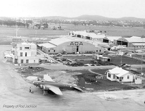 Archerfield Airport Terminal in World War Two, with a Boeing B17 Flying fortress in the foreground.