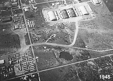 Aerial shot of Archerfield in 1943, with large Kerry Rd hangars at top and the mysterious ex-mine waterhole in bottom right corenr.